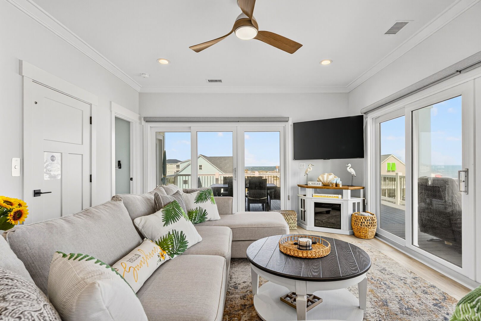 Upstairs living room with comfortable seating and ocean views